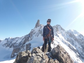 Wei Jie on the summit of Aiguille Marbrees, with ent du Geant in the background
